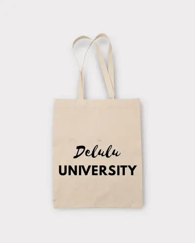 Beige tote bag with 'Delulu University' text on a white background
