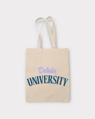 Beige tote bag with 'Delulu University' text on a white background