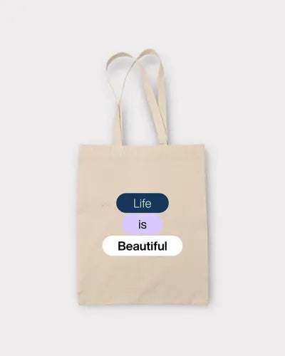 Beige tote bag with 'Life is Beautiful' text on a white background