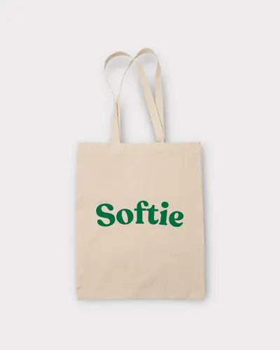 Beige tote bag with 'Softie' text in green on a white background