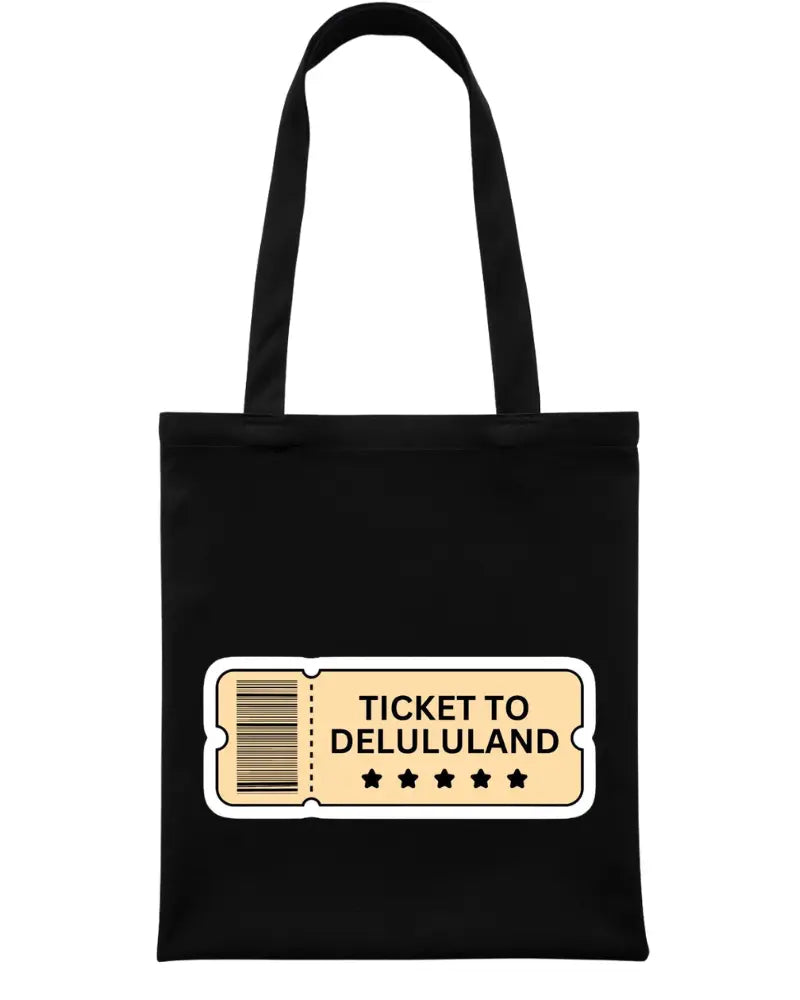 A black canvas tote bag with two black shoulder straps, featuring a graphic print of a vintage-style ticket that reads 'TICKET TO DELULULAND' in black text on a beige background with a white border. The bag is photographed against a solid white background.